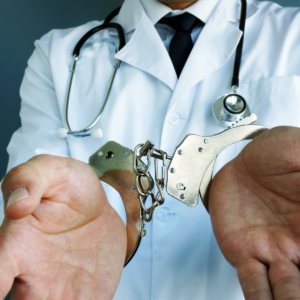 Doctor in handcuffs